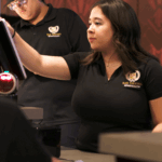 B&B Theatres employee operating cinema POS