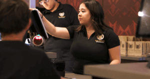 B&B Theatres employee operating cinema POS
